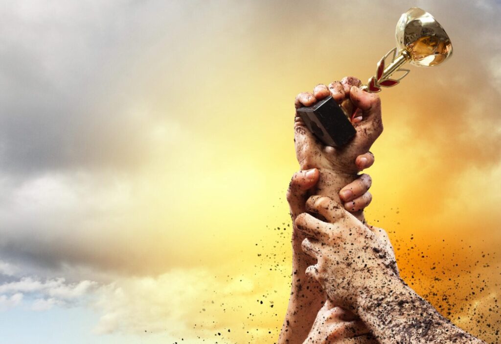 Hands squeeze the coup winner against lightning dark sky