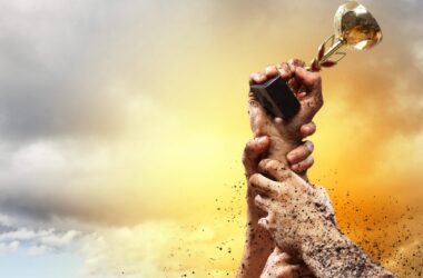 Hands squeeze the coup winner against lightning dark sky