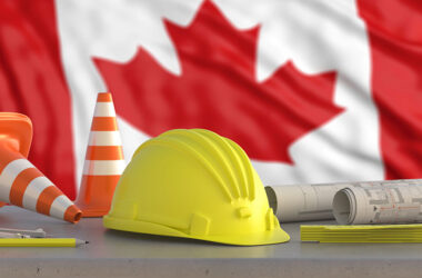 Yellow hardhat with the Canadian flag in the background