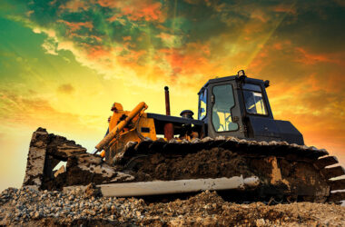 bulldozer on a building site at sunset