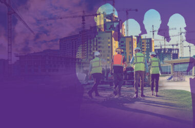 Photo illustration of workers in PPE clothing walking towards construction
