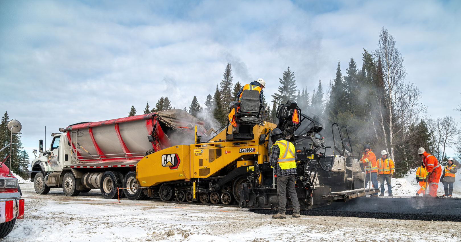 Construction crew paving road