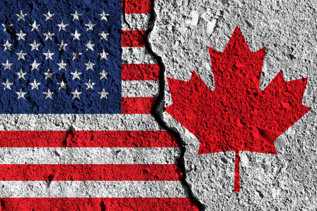 Crack between America and Canada flags. political relationship concept