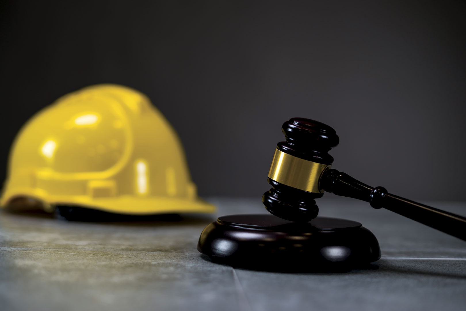 Hard hat and gavel on stand