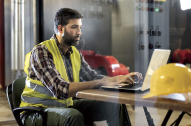 Construction worker on laptop