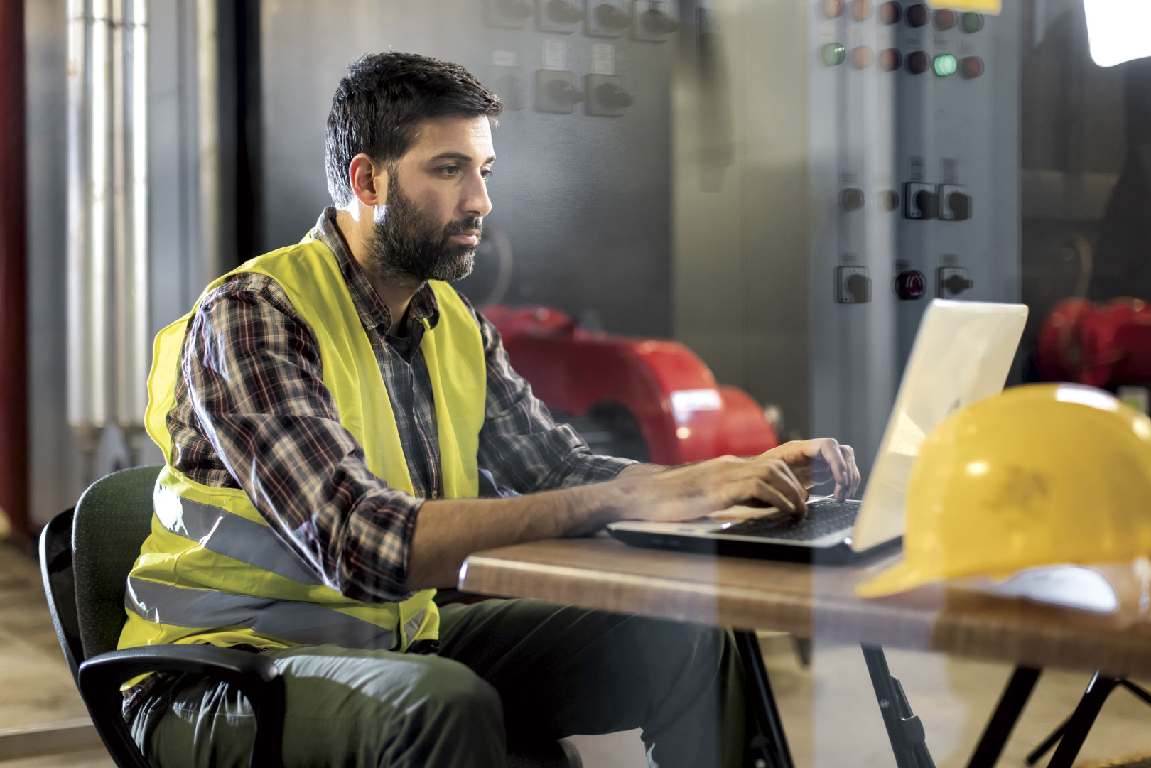 Construction worker on laptop