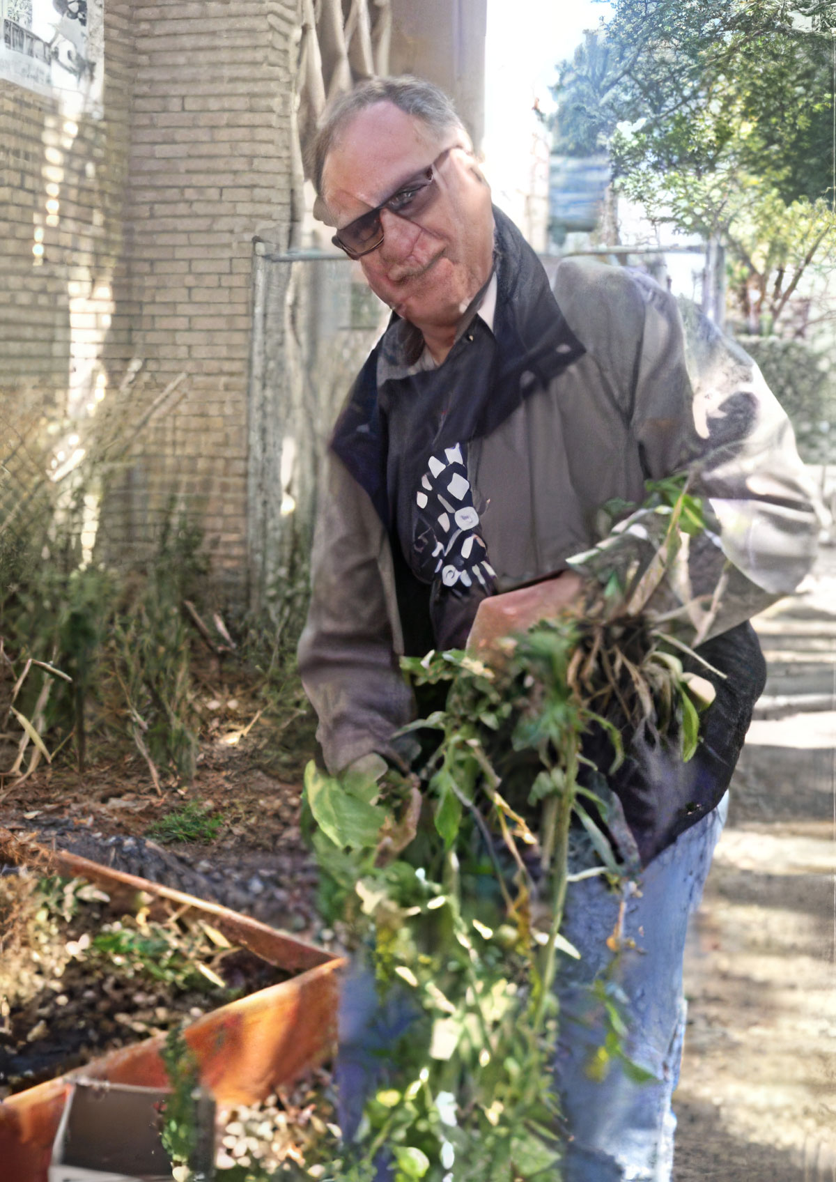Carlyle Murray tending to his garden