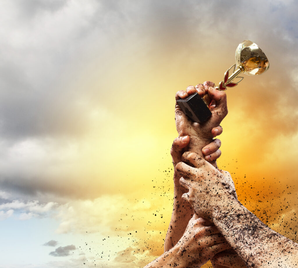 Hands squeeze the coup winner against lightning dark sky