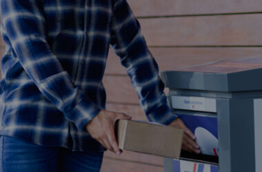 Man carefully placing a package on the doorstep for Purolator pickup, ensuring a secure handoff for efficient delivery.