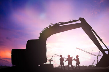 silhouette engineer in a building site over Blurred construction site