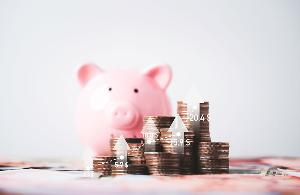 Increasing heap of coins stacking with up arrow graph and pink piggy bank , Money saving and deposit for investment to get profit and dividend concept.