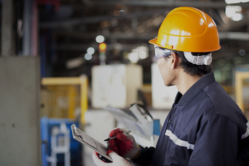 Portrait of asian engineer standing in the factory