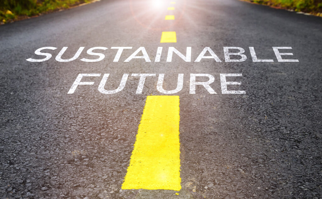 Digital illustration of "Sustainable Future" painted on highway.