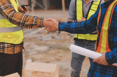 Professional Mechanical Engineer team Working on Personal Computer at Metal lathe industrial manufacturing factory. Engineer Operating lathe Machinery. Product quality Inspection