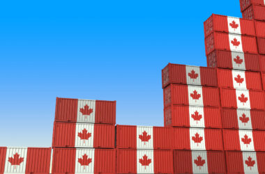 Industrial containers with flags of Canada making a rising graph.