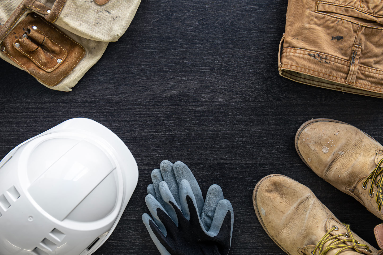 Builder clothes, worker uniform on wooden background