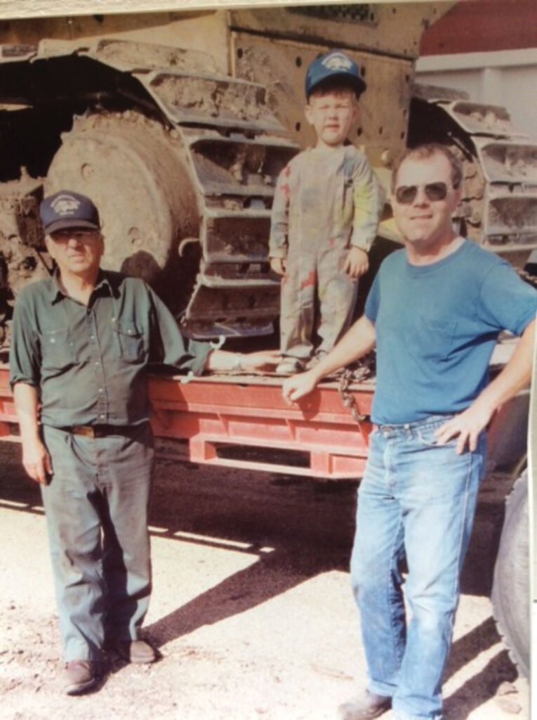 Larry Urick, Peter and Keegan with trailer in background