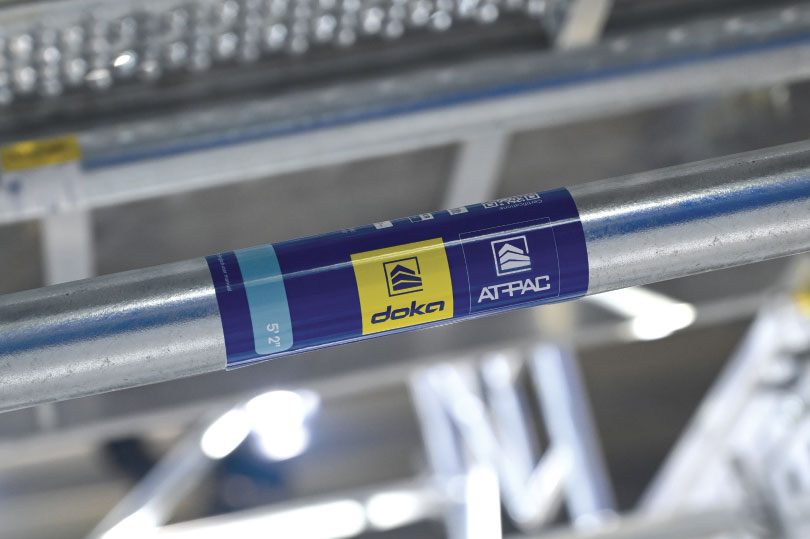 Closeup of DOKA label on steel rod