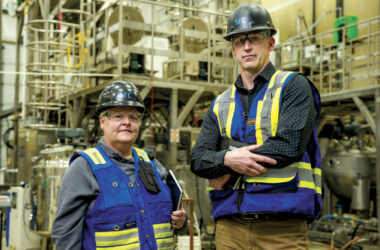 Two workers in safety equipment