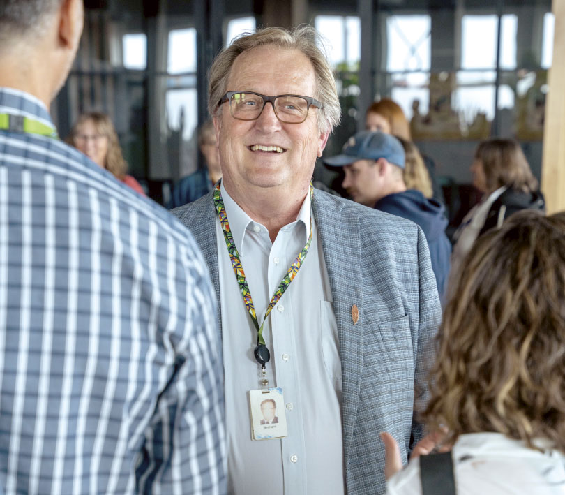 Bernard Gartner chatting with others