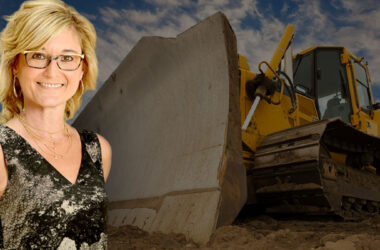 Shantel Lipp in foreground with bulldozer in background