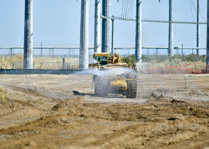 Machinery spraying ground on site