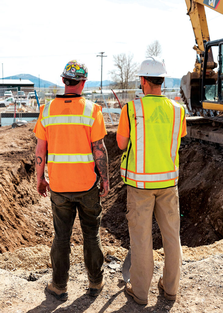 Two workers chatting on construction site