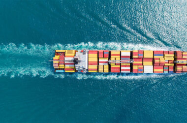 Express Cargo Container Ship with contrail in the ocean ship carrying container
