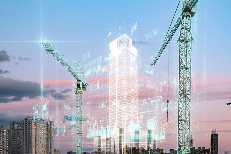 Two construction cranes frame a central glowing digital hologram of a skyscraper against a twilight sky