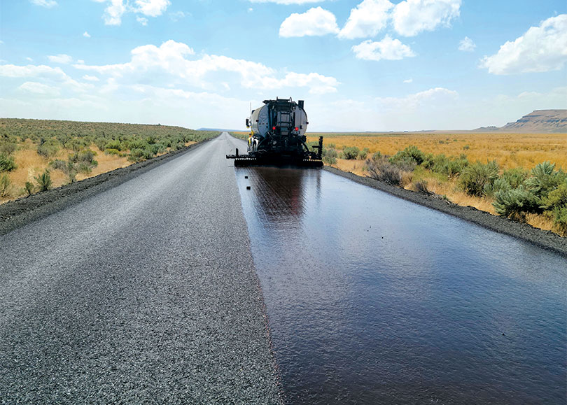 Truck laying fresh asphalt