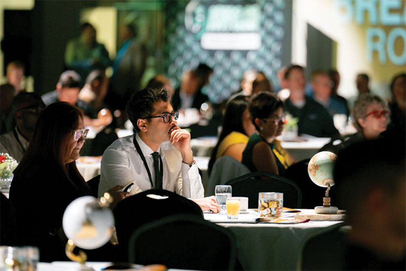 Attendees seated at tables