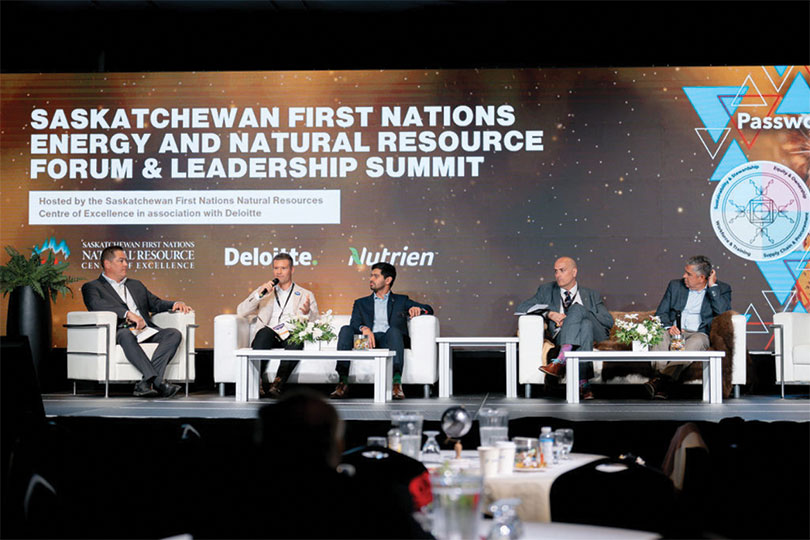 Speakers seated on stage