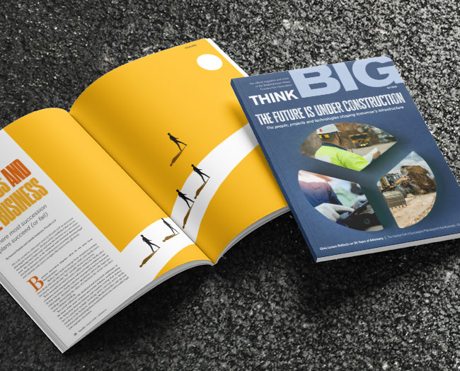 Cover and inside spread of latest issue, sitting on freshly asphalted road